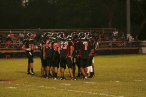 Varsity team in a huddle