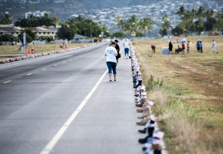 Boots lined up the Ford Island runway for the 8K Hero and Remembrance Run. (U.S. Navy photo by Mass Communication Specialist Seaman Johans Chavarro)