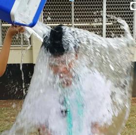 Sierra Macias (12) assists reporter Algeo Rosario (12) with his Ice Bucket Challenge by personally dousing him with ice water. Dozens of Rams have taken up the challenge, and join thousands of people around the world to promote awareness of ALS. “The ice water was ridiculously cold,” Rosario said, “but it’s all for a good cause.” 