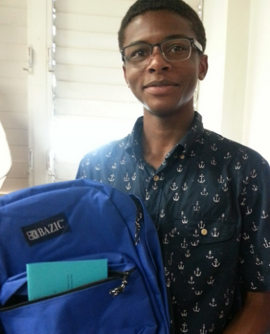 Andreas Casillas (11) holds a backpack in his advisory class. National Honor Society is organizing a school supply drive for children living at the Institute for Human Services, a homeless shelter. The beginning of a school year is always exciting, very hopeful, a chance for a new start, a clean page,” NHS advisor Beverley Vallejo- Sanderson said, “and if a child can start off with a new bag with new supplies, it may be the beginning of a best year ever.