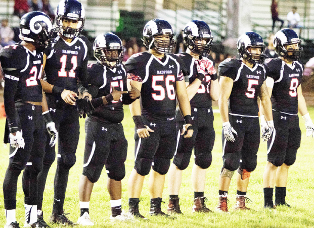 Senior players line up for the coin toss in the homecoming game against Kalaheo High at Aiea High School. Rams won 44-7 against the Mustangs. Rams varsity football is undefeated 10-0 with one game left in the Oahu Interscholastic Association playoffs. “We have had a long season with many ups and downs, but thanks to the coaching staff, we were mentally and physically prepared,” Dylan Lewis (11) said.