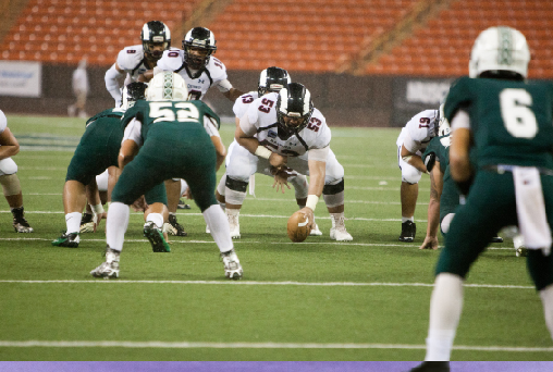 Wide Receiver and Kick Returner DJ Morton (10) motions pre-snaps while Quarterback Quintin Iriarte (12) takes the snap from Offensive Line Tayvis Passos (12). Rams beat Kapaa Warriors (30-16) to win the State Division II Football Championship title.“It feels great knowing you’re a champ forever,” Defensive Back Sipa Leafa (11) said.