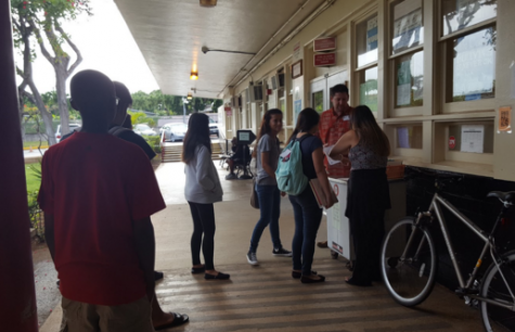 Students who do not have their school-issued identification badges during the first class period of the school day are sent to the main office, and wait in line for temporary ID passes. Teachers and administrators are enforcing a stricter policy on making sure that identification badges are worn all day. “Enforcement comes through reminding our students the importance of wearing their IDs and the purpose of having it visible at all times,” Principal James Sunday said.