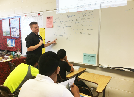 English resource teacher Nathan Krahn breaks down American music to his sophomore English class. He is a transplant from Washington who shares the same distinction as most of the students at the school. “I am an Air Force child, so I have lived in various places,” he said.