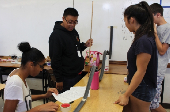 Physics students Arianna Gaskins (12), Kriztofer Caraang (12), Angela Peralta (12), and Mitchell Gawlik (12) investigate the concept of roller coasters to learn about mechanical energy and conservation of energy. Through a self-study process, teachers are involved in making sure that students are engaged and learning. “Physics is a fun, hands on class where we can do a lot of formative assessment to ensure our students are understanding the concepts,” science teacher Teresa Williams said.