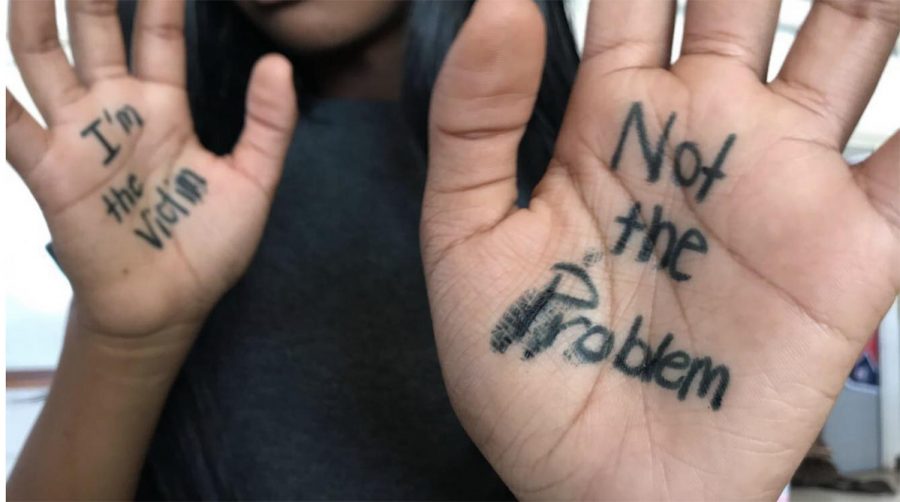 taff reporter Lailona Holloway (12) writes, “I’m the victim” and “Not the problem” on her hands to signify how victims feel when they are seen but not listened to. One in four women and one in six men will be a victim of sexual assault during their lifetime.