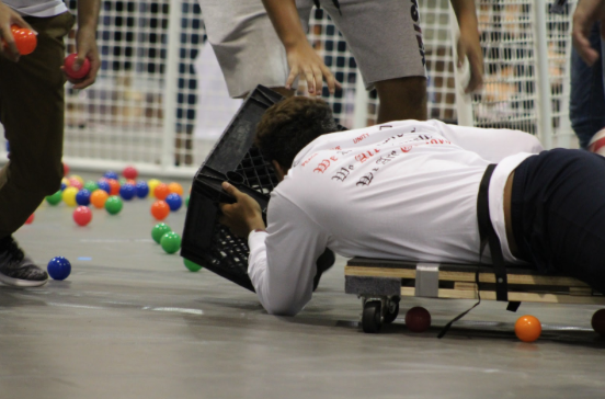 Justin Coronado (11), said “[Hungry, Hungry Hippos] consisted of 5 teams freshmen, sophomores, juniors, seniors, and teachers each trying to put as many balls as possible into a basket. One person from each team was tied down to a chair and another teammate had to pull them in and out to retrieve the balls. Whoever got the most balls in the basket won."
Matai Suitonu, another student who played, said "The game they had me play was definitely tiring. It was a lot of fun and it felt good competing against the other classes and gettin the dubs.” Photo by Elaina Bolanos