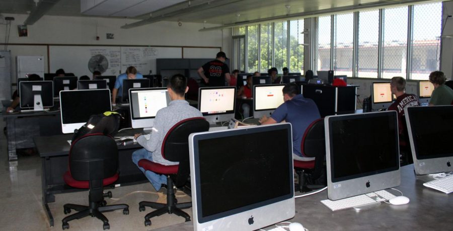 Krahn is a passionate teacher who wishes to see the school embrace the future of technology. Here he is seen watching over his students as they work ensuring they retained the knowledge they learned.
