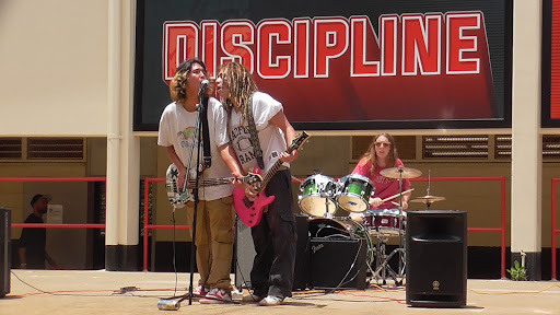  Band, Stubborn Stubborn, performs their own music to raise money for Maui. The band performed on the Radford stage in front of the 70s wing during lunch.
