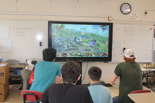 Hectic and lively members play Super Smash Bros on a wide-screen monitor. Club members officers include: President Riley Allen (11), Vice president Aubrey Adams (12), Treasurer Alex Tate (10), Secretary Issac Powers (11), and Moderator Kurtis Tate (11).