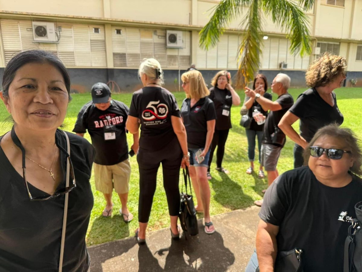 (Photo Credit: David Simmons) Class of 1973 alumni gather by the senior patio.