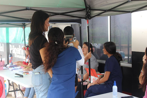 Volunteer students provide health and vital screenings for blood donors with the help of Health Services Pathway and Career and Technical Education teacher Jennifer Sugahara.