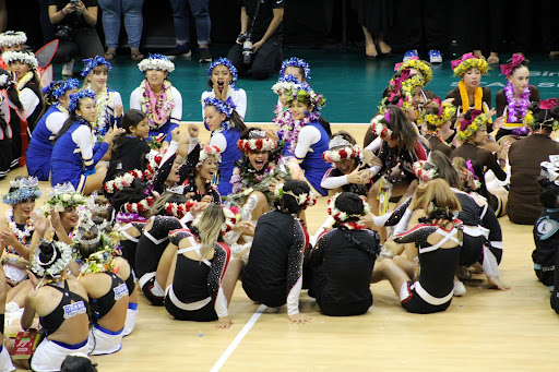 Radford’s skilled cheerleading team reacts with joy when informed they are the co-ed champions of the state. 