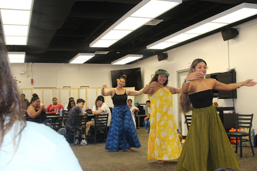 Kumu (teacher) Tehani Ching and volunteers from her hālau dance to the Hawaiian song Ke Aloha.