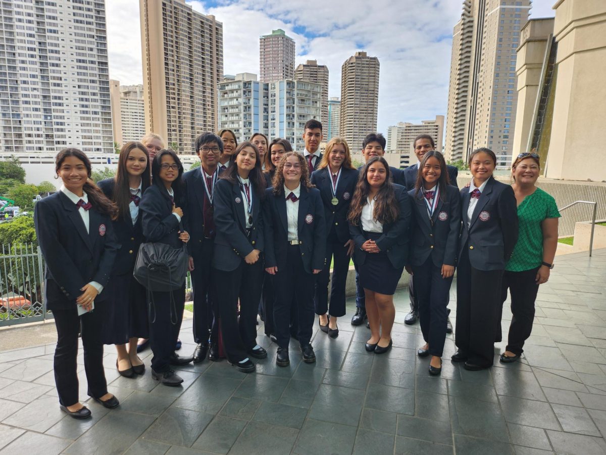 (Photo courtesy of Jennifer Sugahara) Students (L-R) Carolina Cabezas (12), Rowen Loftes (11), Kaylie Back (10), Precious Faith Nunez (12), John Joseph Asuncion (12), Sarah Thai (11), Kaylee Coffey (11), Lisa Reece (11), Landen Simonds (10), Sadie Schulz (12), Rob Delos Santos (11), Jonathan Anderson (11), Jaemee Mendoza (9), Madison Soria (9), Alexia Fisher (9), Chloe Hewett (12), and Zoe Kubina (10) pose with HOSA teacher Jennifer Sugahara at the CTE State Competition. HOSA has participated in the competitive event since 2017.