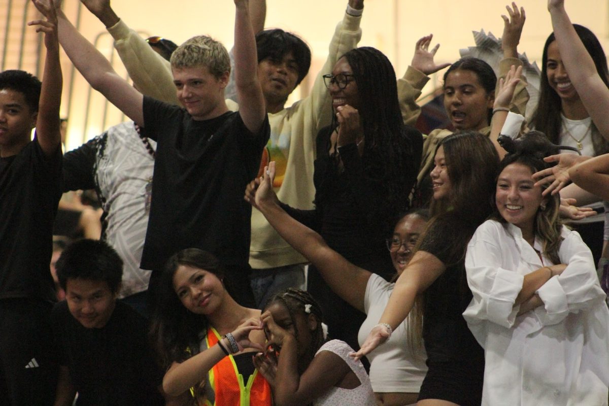 Sophomore Leadership poses for the end of their skit at the homecoming assembly in the gym on Oct. 15th.